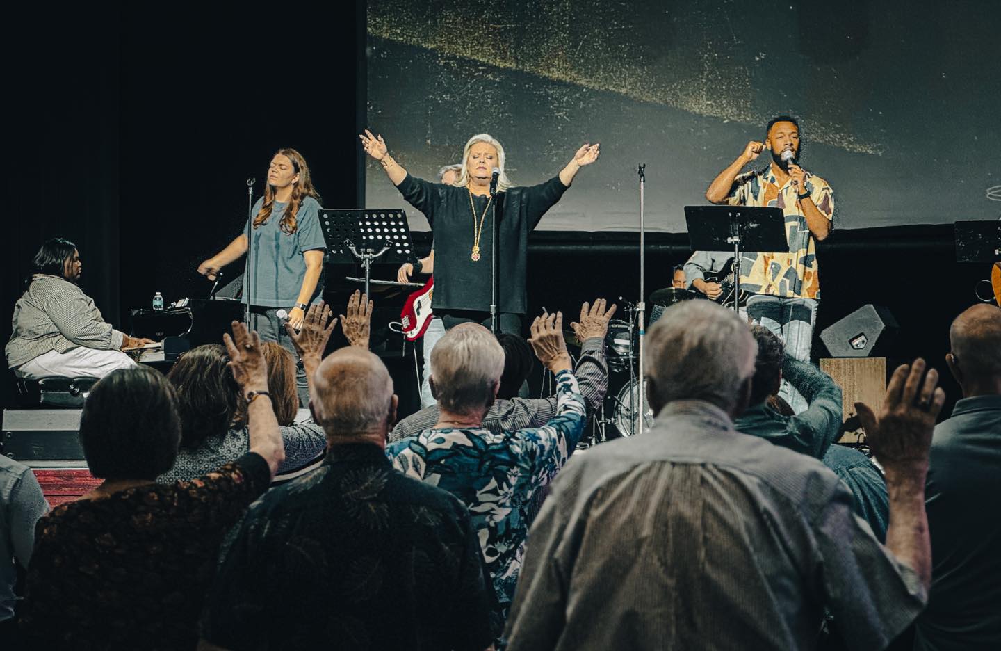 CHURCH 1 men touching each other's foreheads