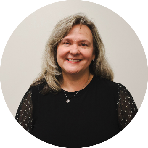 a child is drawing on a piece of paper