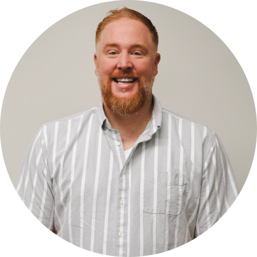 a child is drawing on a piece of paper