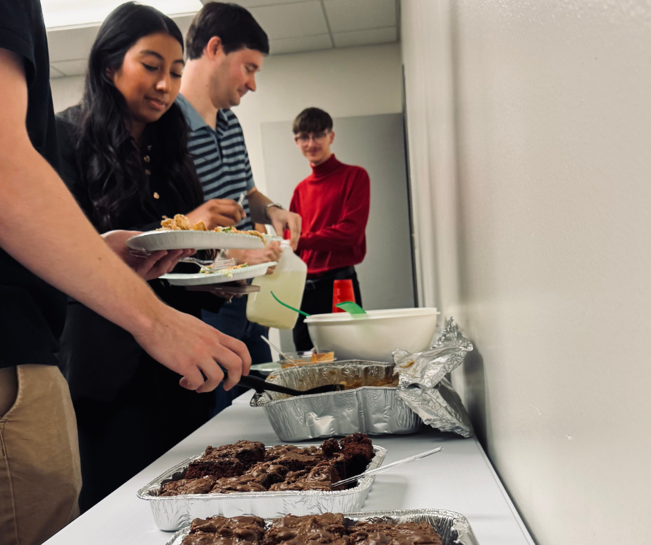 YA man in white crew neck t-shirt sitting on blue chair