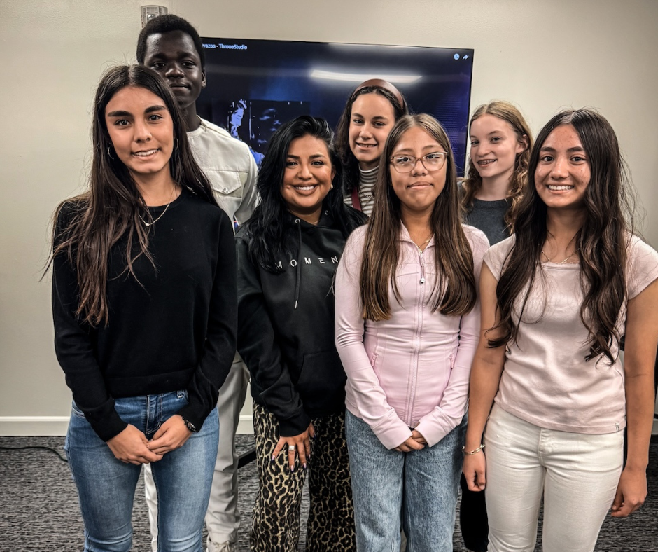 youth man in white crew neck t-shirt sitting on blue chair